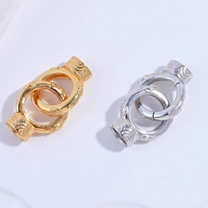 Detailed macro view of S925 silver and gold jewelry clasps with ornate cloud engraving