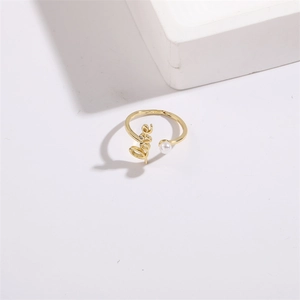 Golden open ring with script Love lettering, zircon accent, and elegant white pearl