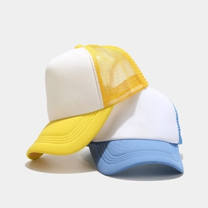 Detail of two-tone mesh trucker caps showing stitching on blue and yellow visors