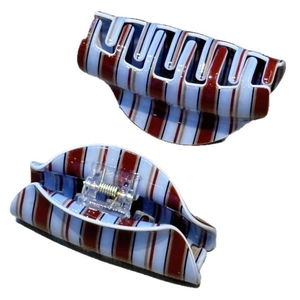 Classic large hair claw clip with red, blue, and white stripes in a retro British style