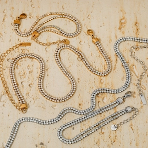 Double-row crystal tennis chain necklace in gold and silver finish with lobster clasp
