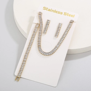 Detail shot of gold-plated stainless steel jewelry set with sparkling zircon inlays