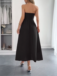 Elegant black strapless A-line maxi dress showing textured fabric and back zipper detail