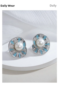 Detail of luxury S925 silver pearl earring with blue zircon and sparkling white diamonds