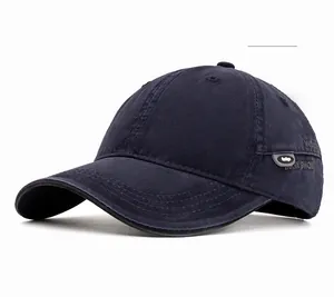 Detailed view of navy blue cotton baseball cap showing twill texture and side design patch
