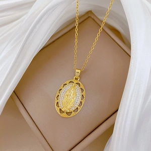 Luxurious gold oval portrait necklace with sparkling crystals and hollow egg shape design