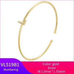 Minimalist gold brass cuff bracelet featuring a pavé zircon T-shape open design