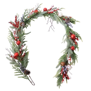 Christmas wreath with red berries, pine cones and ornaments on a white background