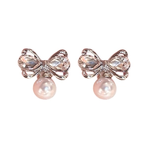 Sparkling silver bow knot stud earrings with white faux pearl and diamond accents