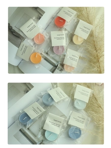 Detailed view of colorful tea light candles in warm and cool tones for home decor