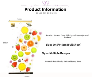 Detailed view of 3D crystal fruit stickers with strawberry and lemon resin motifs