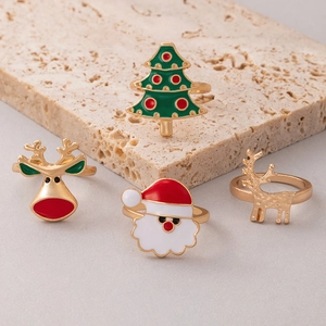 Détails de bagues de Noël festives avec rennes, Père Noël et motifs en émail coloré