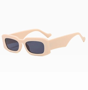 Front view of beige rectangular frame sunglasses with dark grey lenses and thick temples
