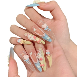 Handmade press-on nails with 3D cartoon bunny and bow decorations in macaron colors