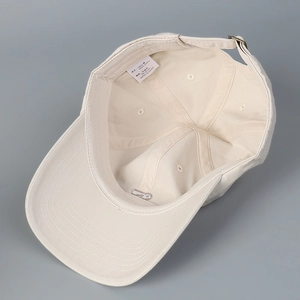 Classic cream cotton baseball cap featuring internal reinforced seams and metal buckle strap