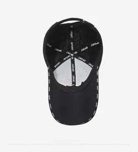 Detail view of black baseball cap interior with reinforced Sport letter printed tape