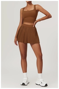 Detailed front view of brown two-piece sports set featuring square neck vest and pleated skirt