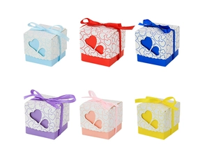 Flat lay of colorful heart hollow candy boxes with ribbons in six different pastel shades