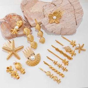 Golden sea theme hairpins with starfish, shells and pearls on white rocks