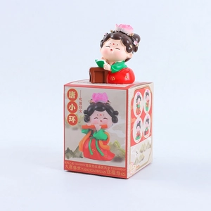Chinese Tang dynasty lady figurine reading with lotus headwear on a colorful gift box