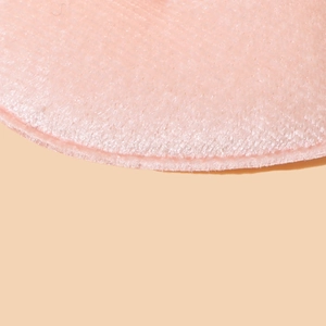 Close-up of pink velvet heart hair clip texture with delicate soft plush fabric detail