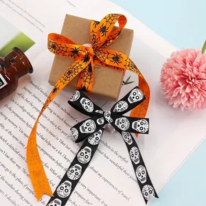 Halloween ribbon set with orange spider web and black skull patterns for DIY gift wrapping