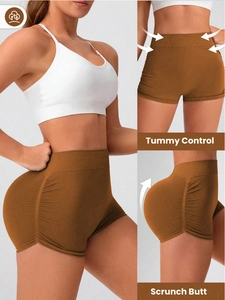 Detail of high-waisted caramel yoga shorts with tummy control and scrunch butt design