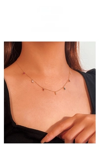 Detailed macro view of the 925 silver gold choker necklace with baguette-cut gemstones