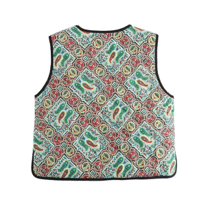 Colorful geometric paisley print padded vest with quilted texture on white background