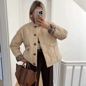 Beige leopard lining quilted jacket with high collar and loose fit casual style