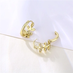 Elegant gold-tone leaf hoop earrings with zircon studs shown from a side profile view