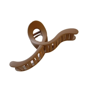 Minimalist matte brown shark hair claw clip for women featuring a wavy silhouette on white background