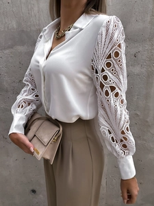 Detailed view of white chiffon shirt featuring intricate geometric lace hollow out sleeves