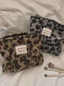 Plush leopard print makeup bags with zipper closure and soft faux fur for travel storage