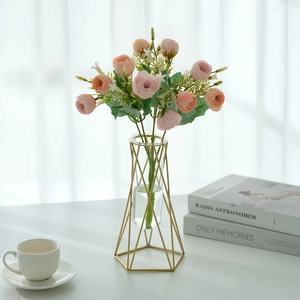Modern gold geometric metal frame vase with glass tube and pink artificial roses