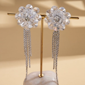Elegant floral crystal stud earrings with long sparkling rhinestone tassels on gold stand
