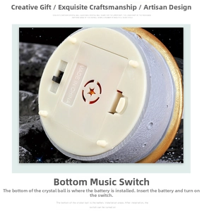 Detail view of moon-themed music box resin base with crater texture and power switch