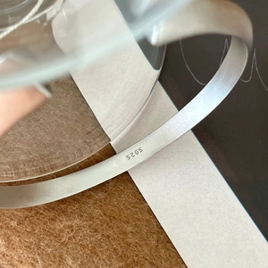 Minimalist S925 sterling silver twisted bangle with matte finish and S925 hallmark stamp