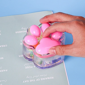 Detail of a cat paw resin storage box mold in translucent purple and pink silicone