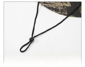 Detail of adjustable windproof chin strap with spring buckle on camo sun hat