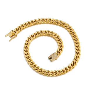 Detailed view of a gold-plated Cuban link chain with a sparkling diamond-encrusted clasp