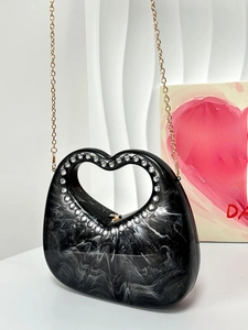 Black marble acrylic heart-handle evening bag with rhinestone detail and gold chain strap