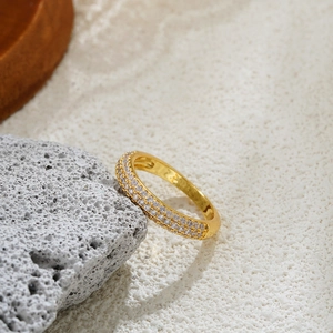 Macro detail of 18k gold ring featuring double row of micro-pave cubic zirconia