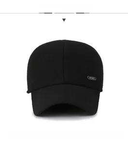 Front view of a thick black wool baseball cap with sport label and ear protection flaps