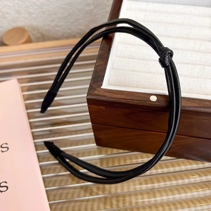 Minimalist double-layered black leather knotted headband for elegant styling