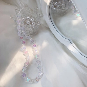 Macro view of iridescent acrylic star beads on a stylish mobile phone lanyard charm