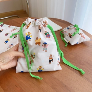 Drawstring cotton storage bag featuring cute bear prints and green braided cords