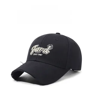 Detailed macro view of vintage distressed brim and white 3D embroidery on baseball cap