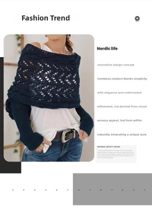 Close-up of navy blue crochet knit shawl featuring intricate hollow-out patterns