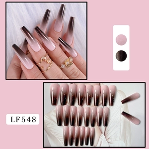 Detailed view of long coffin press-on nails with pink to dark brown gradient finish
